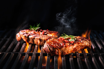 Wall Mural - Beef steaks on the grill