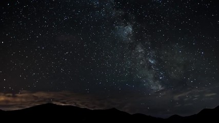 Wall Mural - time lapse of milky way galaxy - moving stars at night - bautiful nature full hd 1920x1080