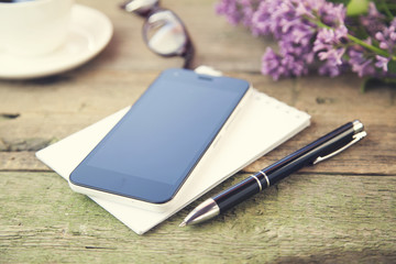 Sticker - phone on notepad, pen, coffee, glasses and flower on table