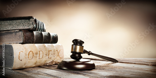 Plakat na zamówienie Gavel And Ancient Books On Wooden Table
