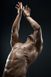 © Alex - Bodybuilder and strip theme: beautiful with pumped muscles naked man posing in the studio on a dark background