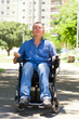 © kraevski - Man in wheelchair practicing meditation at the park