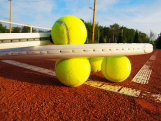 Wall Mural - Tennis ball and racquet on a tennis clay court