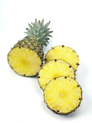 Wall Mural - pineapple top and slices on white