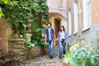 © Acronym - Young couple being tourists exploring an old town