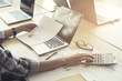 © 88studio - woman working with calculator, business document and computer no