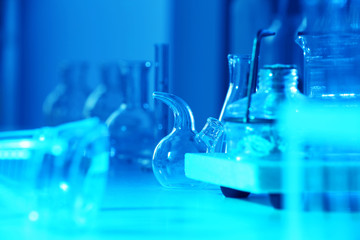 Wall Mural - test tubes and flasks on laboratory table closeup