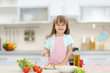 © Africa Studio - Little girl with a plate of vegetable salad.
