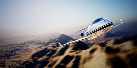 Picture of white modern and luxury generic design private jet flying in blue sky over earth.Uninhabited desert mountain background.Business travel picture.Horizontal,motion blurred effect.3d rendering