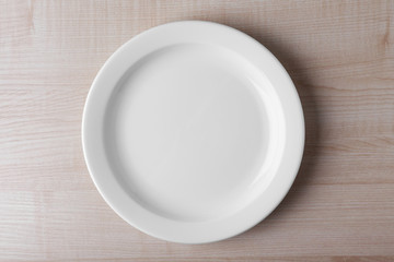 Canvas Print - Empty plate on wooden background