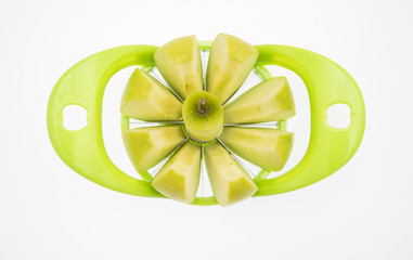 Wall Mural - apple with apple cutter on white baackground