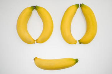 Wall Mural - face of banana with white background