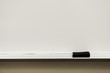 close up on white board eraser and board in classroom