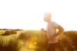 © mimagephotos - Healthy young african man running at the beach