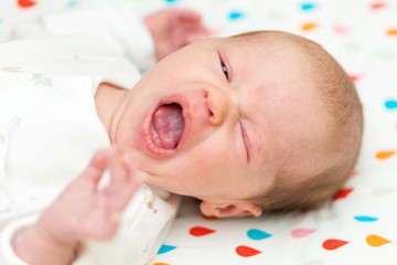 Wall Mural - Newborn baby screaming in pain with colic