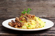 Beef Stroganoff With Mashed Potatoes On Wooden Table