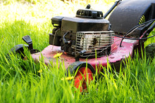 Old Lawn Mower In Tall Grass, Neglected Gardening