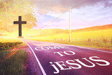 Fototapeta Londyn - Wooden cross and a road to Jesus