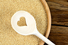 Amaranth Seeds In A Bamboo And Wooden Spoon With Heart Shape