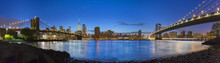 Panoramic View Of Manhattan And Brooklyn Bridges At Night, New York, USA