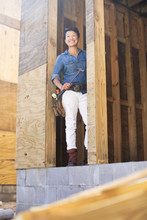 Portrait Of Mid Adult Woman Building Her Own Home