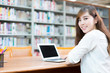 © zhu difeng - young beautiful asian girl in school library