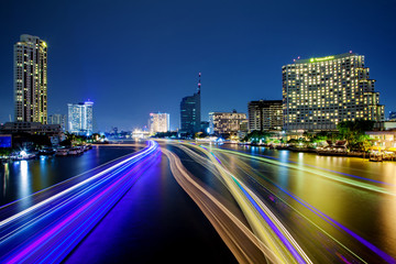 Light effects over time after sunset on Chao Phraya river in Bangkok City, Thailand.