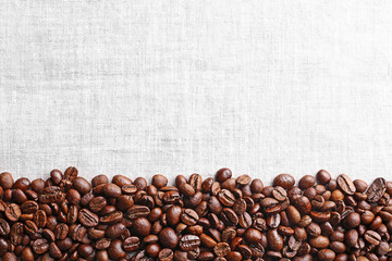 Poster - Frame of coffee beans on sackcloth background