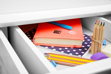 Sticker - Stationery in open desk drawer closeup