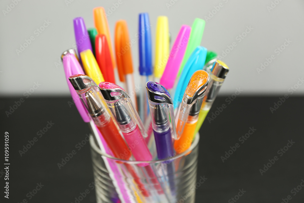 Set of colored pens in glass, close up