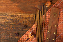 Fragrant Incense On A Brown Wooden Background
