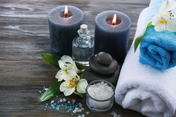 Poster - Spa still life with flowers and candlelight on wooden background