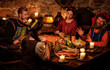© Nejron Photo - Medieval people eat and drink in ancient castle kitchen interior