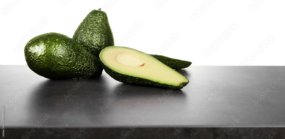 Fresh avocados on a white background