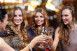 © Syda Productions - happy women with champagne glasses at night club