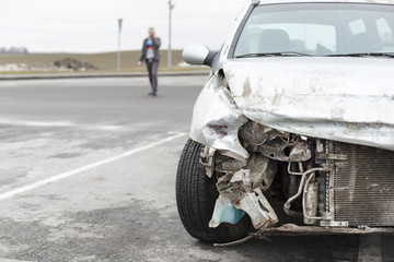 broken car after the accident in  foreground