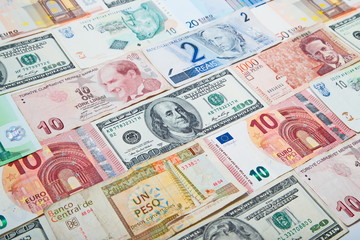 Background from paper money of the different countries. American dollars in the middle