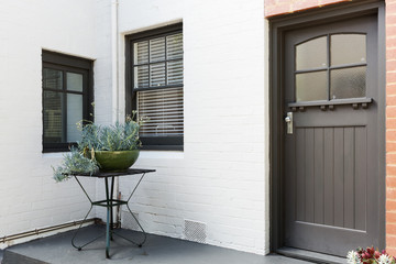 Entry porch and frnt door of an art deco style apartment