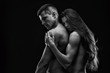 Nude sexy couple. Art photo of young adult man and woman. High contrast black and white muscular naked body