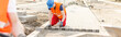 © Photographee.eu - Construction worker paving street