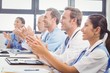 © WavebreakmediaMicro - Medical team applauding in conference room