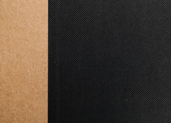 black fabric texture with brown paper strip