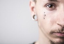 Handsome Stylish Young Man With Tattoo And Piercing