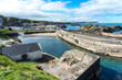 Ballintoy, Antrim, Northern Ireland. The harbour and beach have featured in several episodes of the Game of Thrones.
