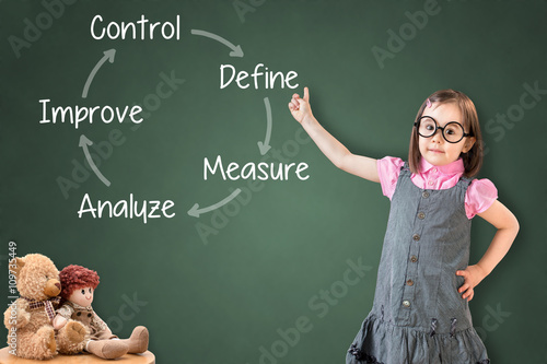 Fotografía Cute little girl wearing business dress and showing improvement process concept on green chalk board