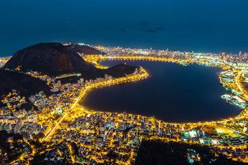 Wall Mural - Aerial view of Rio de Janeiro, by night. Copacabana, Ipanema, Leblon and Lagoa neighborhoods border Rodrigo de Freitas lagoon