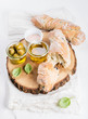 Fresh ciabatta bread, Mediterranean olives and fresh vrgine oil with basil 