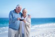 © WavebreakmediaMicro - Cute mature couple looking at smartphone