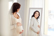 © Syda Productions - happy pregnant woman looking to mirror at home