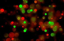 Festive Bokeh Illumination With Warm Red And Green Lights On Black